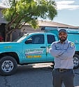 tucson exterminator in front of service truck